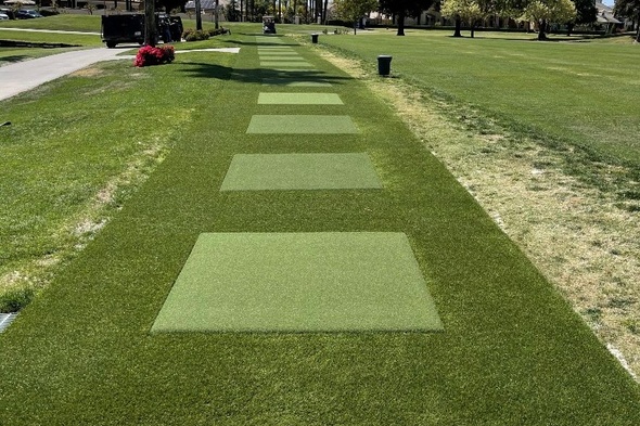 Kennewick Outdoor tee line with light green synthetic grass boxes inside a dark green synthetic grass strip